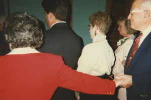 Eileen reach for Henry at a family wedding in 1996